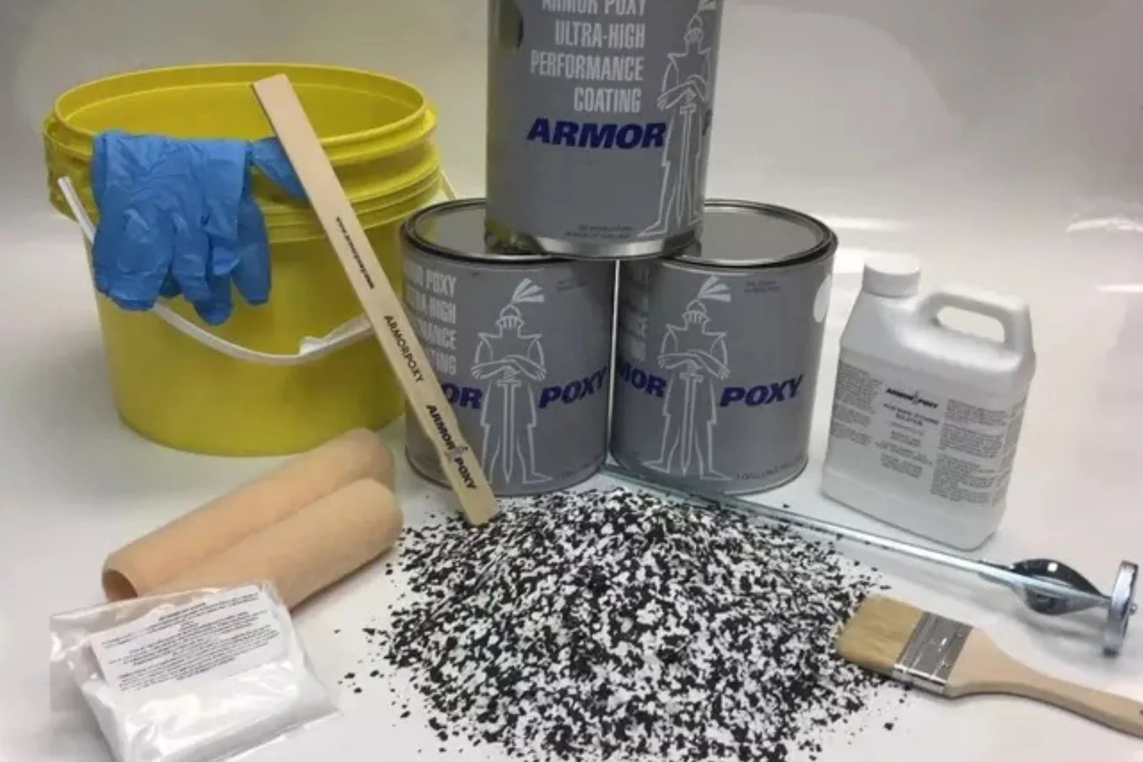 Polyaspartic floor coating kit with cans, decorative chips, roller and brush