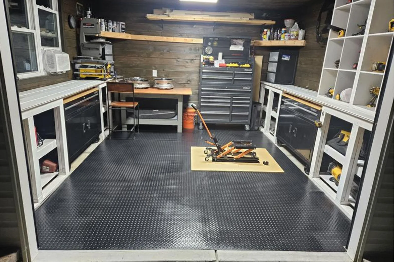Workshop with tool benches on a black Diamond Nitro garage flooring roll