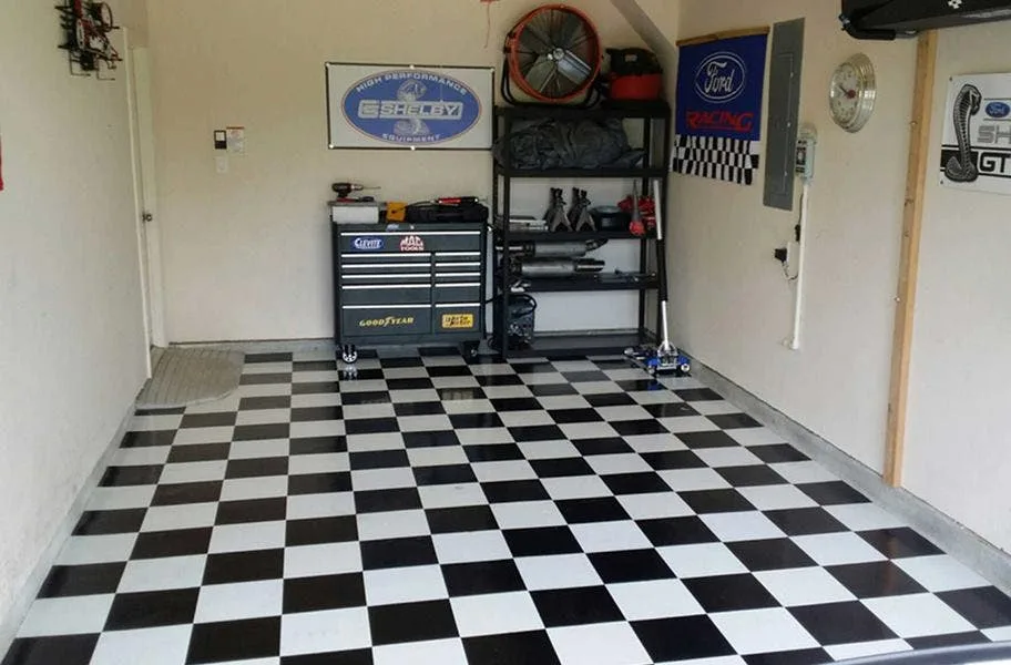 Black and white checkered peel & stick vinyl floor tiles in garage