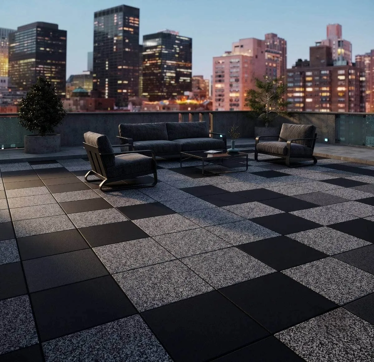 Rubber patio pavers in a checkerboard layout on a corporate rooftop patio at dusk
