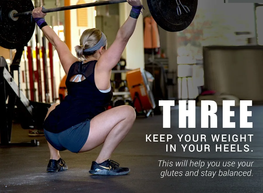 Three: keep your weight in your heels - woman in a deep overhead squat