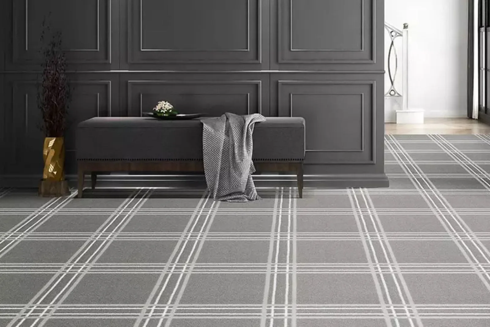 Elegant hallway with a modern gray plaid patterned carpet, a chic and sophisticated flooring choice for residential and commercial spaces.