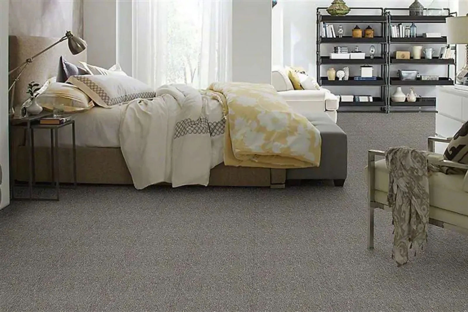 Cozy bedroom with a soft, durable gray carpet, a comfortable and stylish residential flooring option.