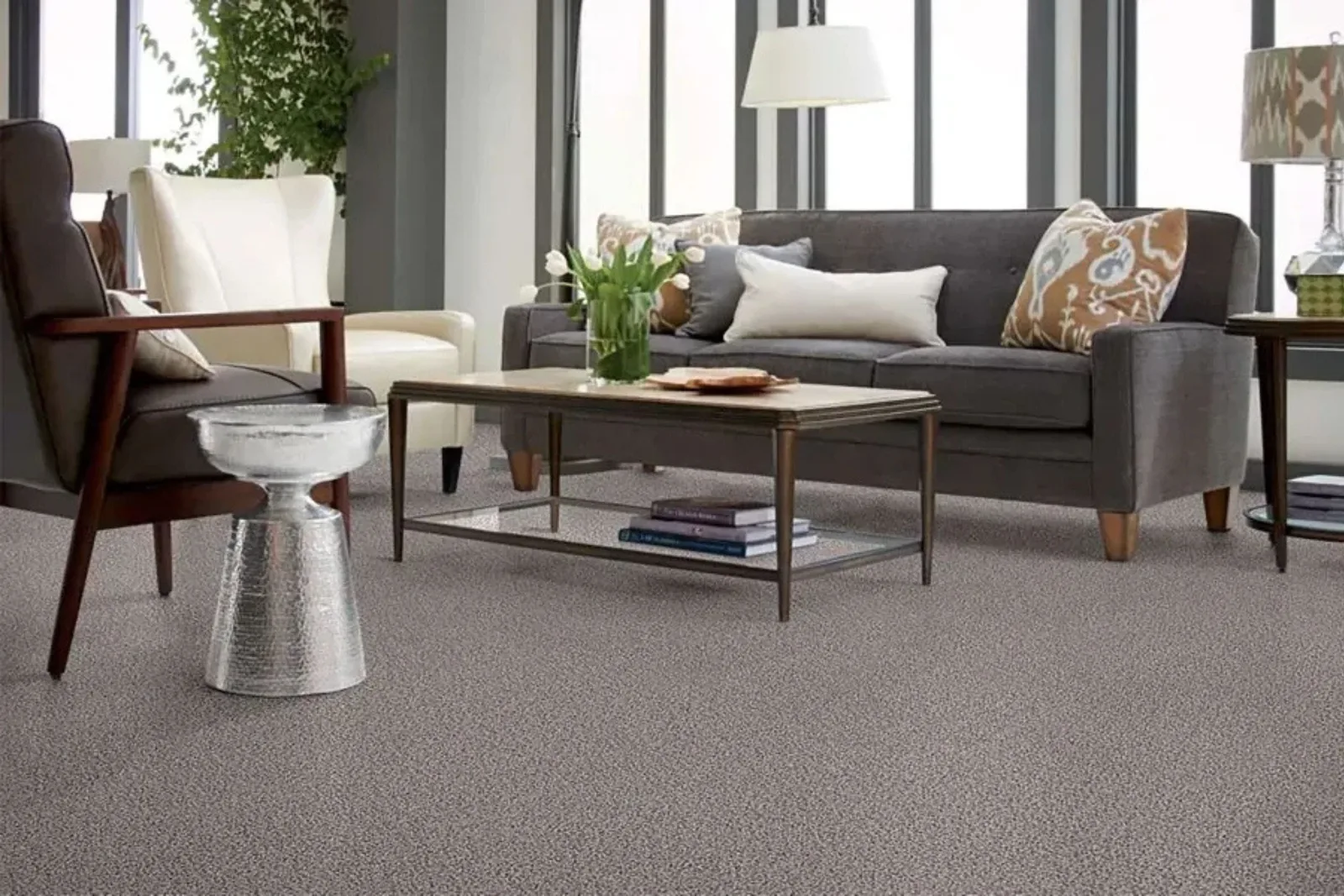 Elegant living room with a durable gray textured carpet, a versatile and comfortable residential flooring solution.