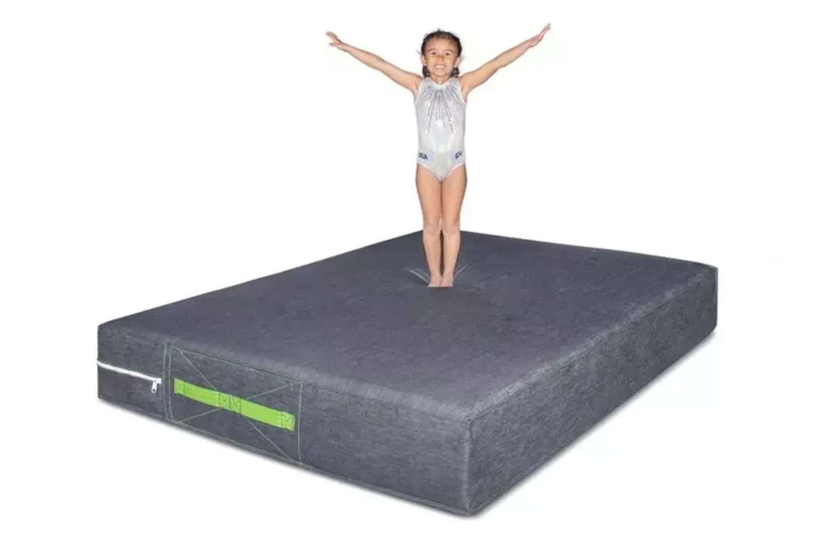 Thick foam crash mat or skill pillow in gray provides a safe, oversized, and shock-absorbent landing mat for tumbling, featuring a young girl practicing a jump.