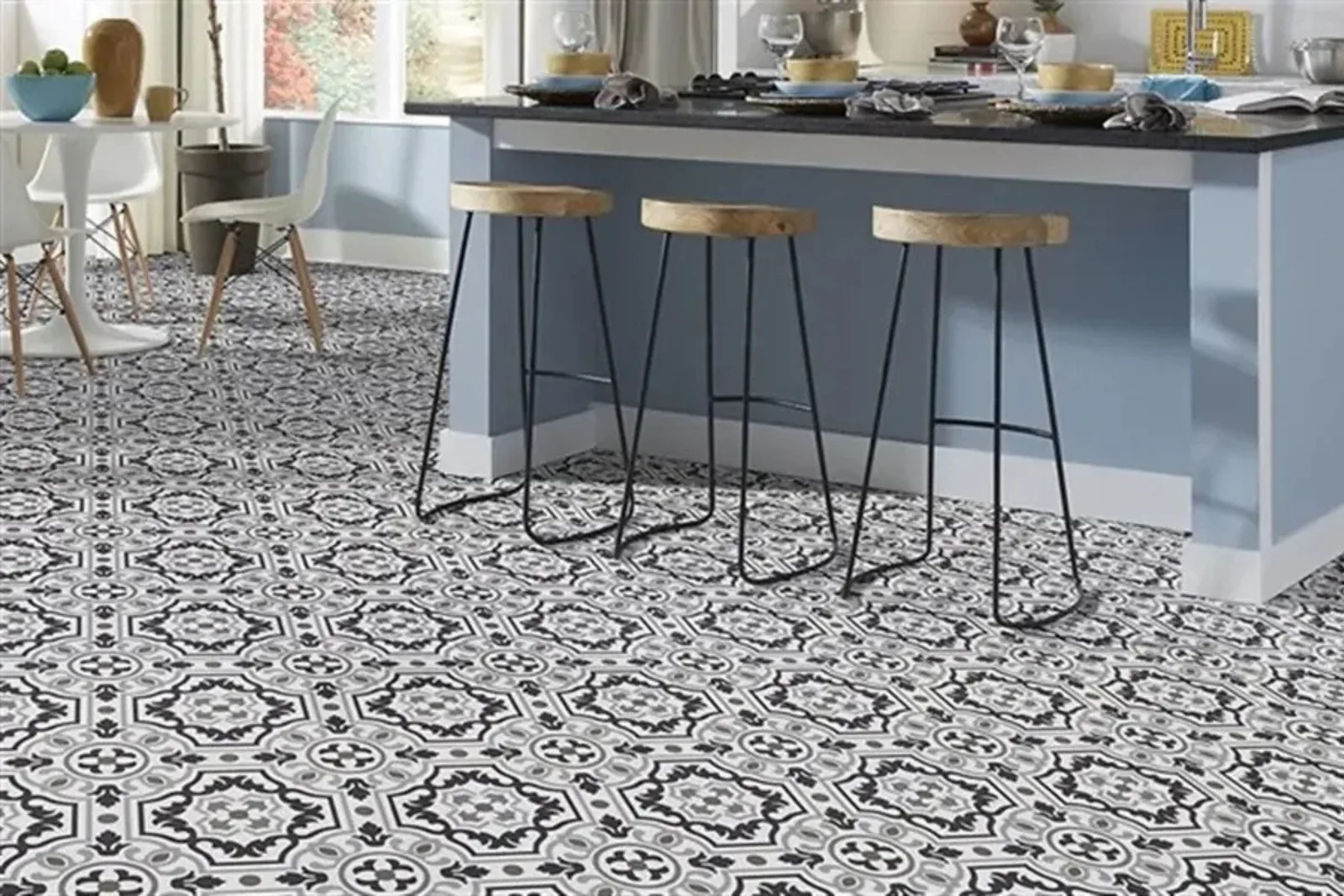 Modern kitchen with durable black and white patterned vinyl flooring, a water-resistant and stylish solution for a high-traffic area.