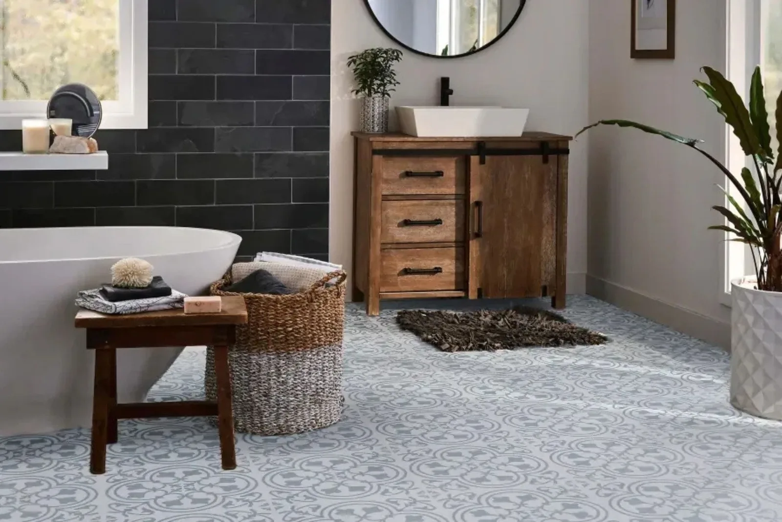 Bright bathroom with durable light gray patterned vinyl flooring, a stylish and water-resistant solution for wet areas.