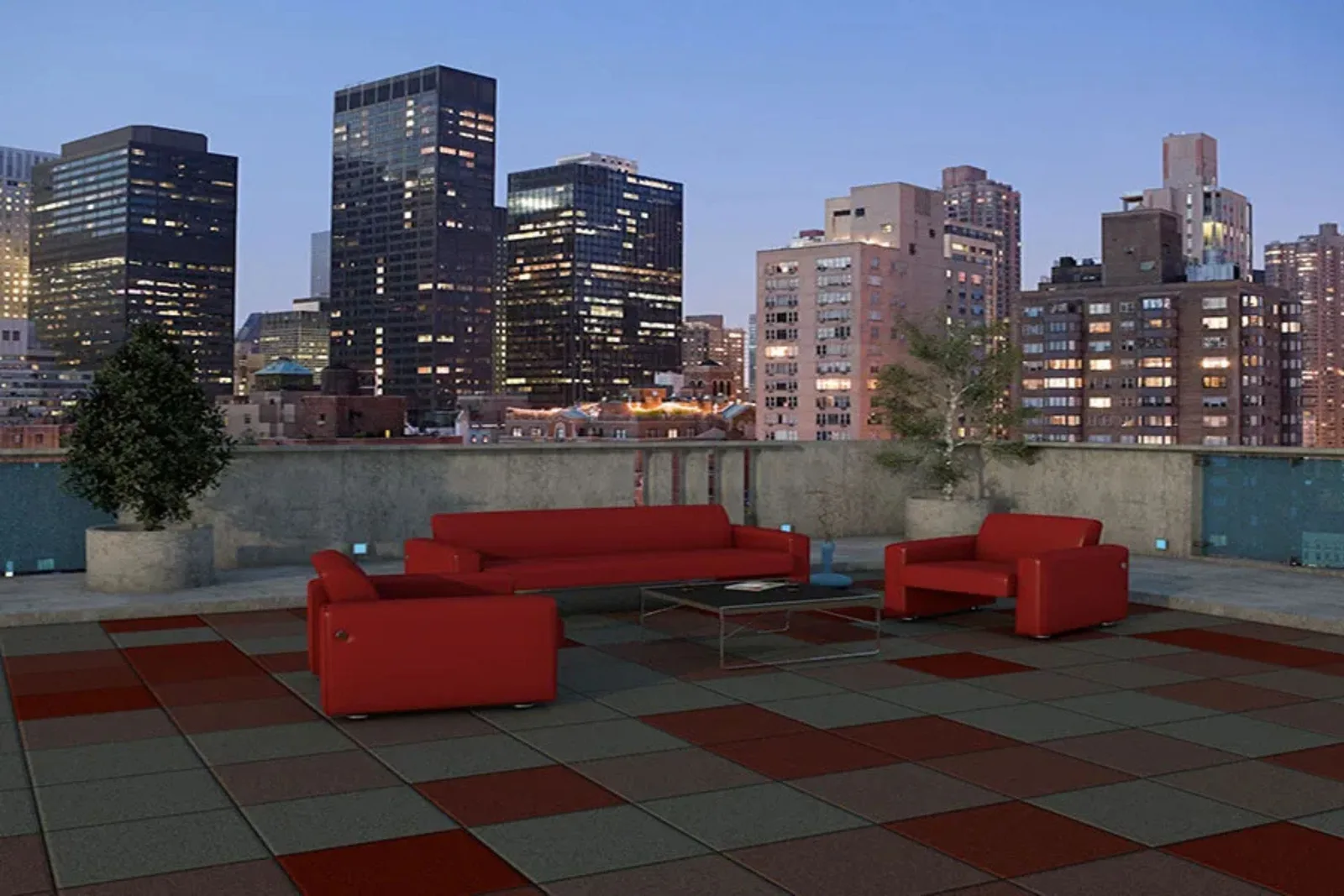 Red couches on rooftop deck tiles looking over the city.