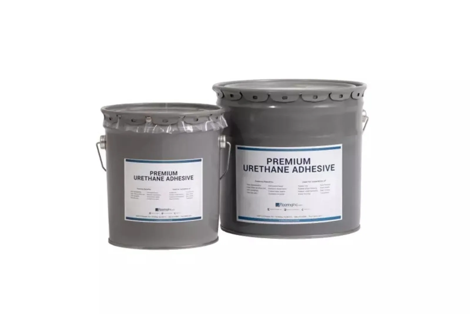 Two gray metal buckets of premium urethane adhesive, a professional-grade and high-performance flooring installation product.