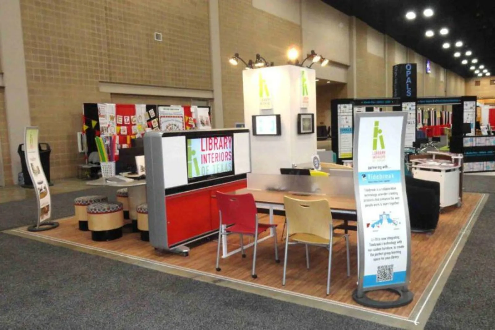 Trade show booth with durable medium wood-look vinyl plank flooring and furniture, a versatile and high-traffic flooring solution for commercial events.