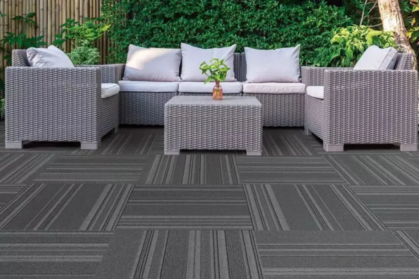 Outdoor patio with durable interlocking deck tiles in a stylish gray-brown pattern, ideal for weather-resistant outdoor living spaces.