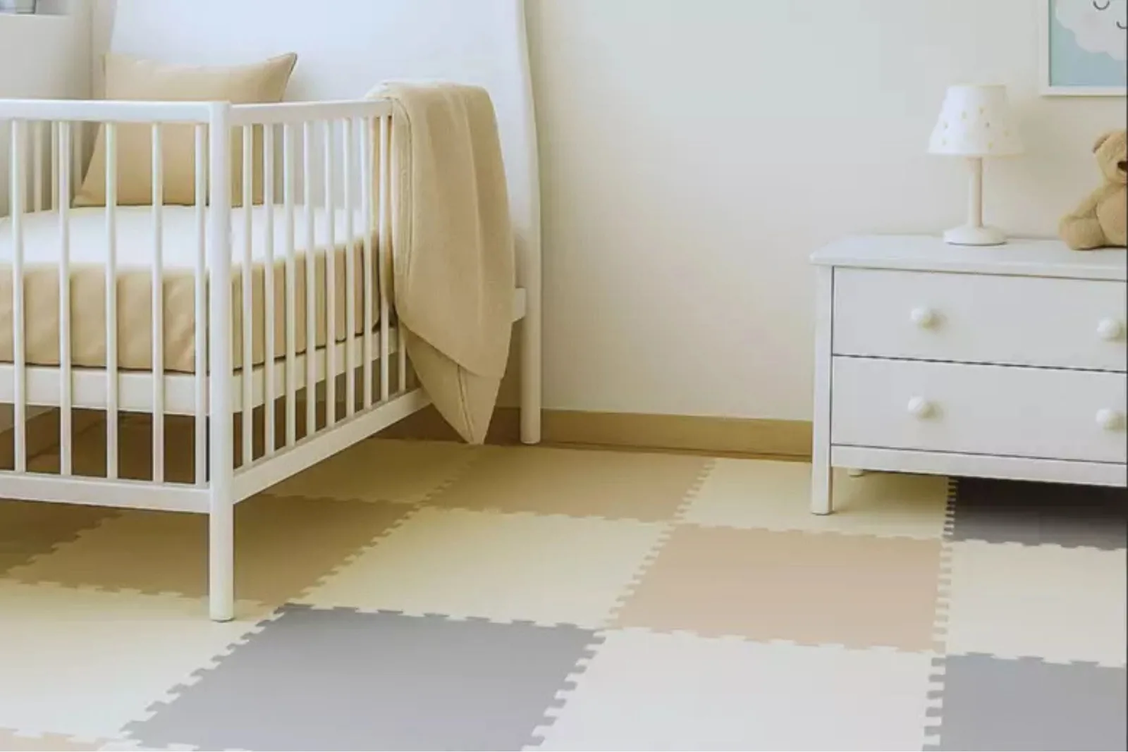 Neutral Foam Play Mat Tiles Foam play mat tiles in a neutral color palette, creating a soft and safe flooring for kids in a nursery or bedroom.