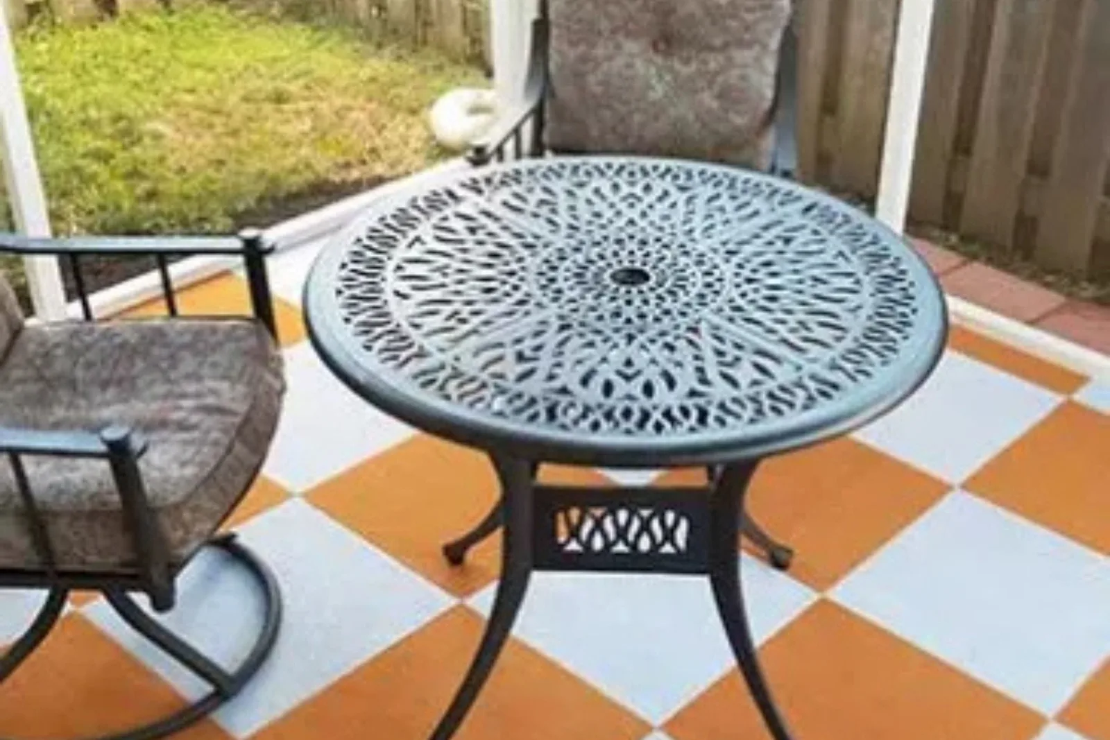 Outdoor patio with durable orange and white checkered deck tiles, providing a stylish, all-weather flooring solution for outdoor living spaces.