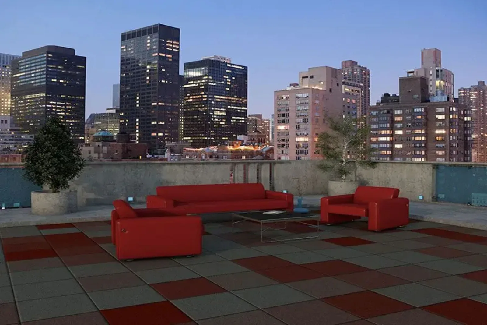 Rubber tile rooftop decking in a red and gray checkerboard pattern, creating a durable and stylish outdoor flooring solution for a city rooftop patio with modern furniture.