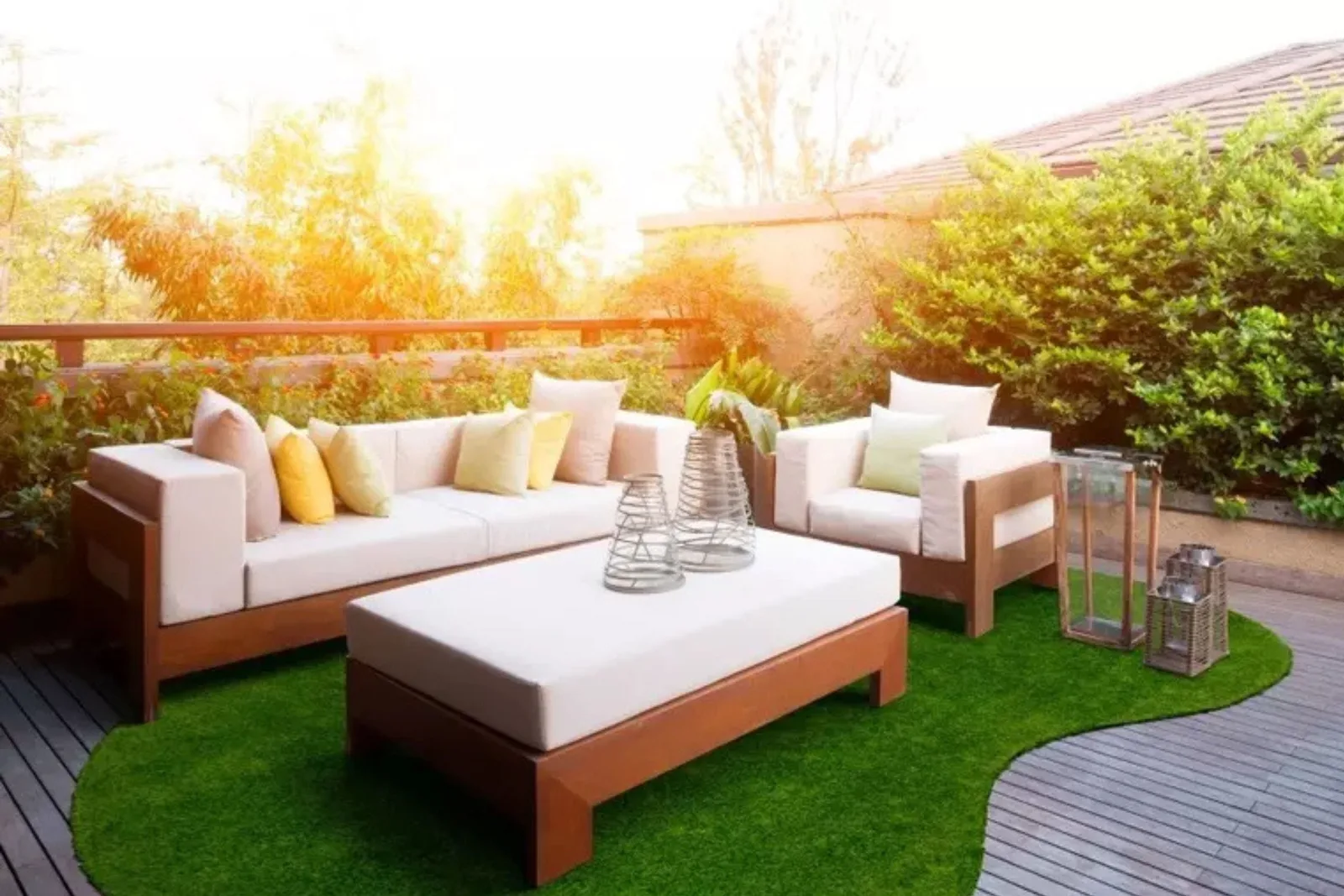 Outdoor artificial grass patio rug in a home with modern patio furniture, creating a soft, maintenance-free, and inviting green space for outdoor lounging.