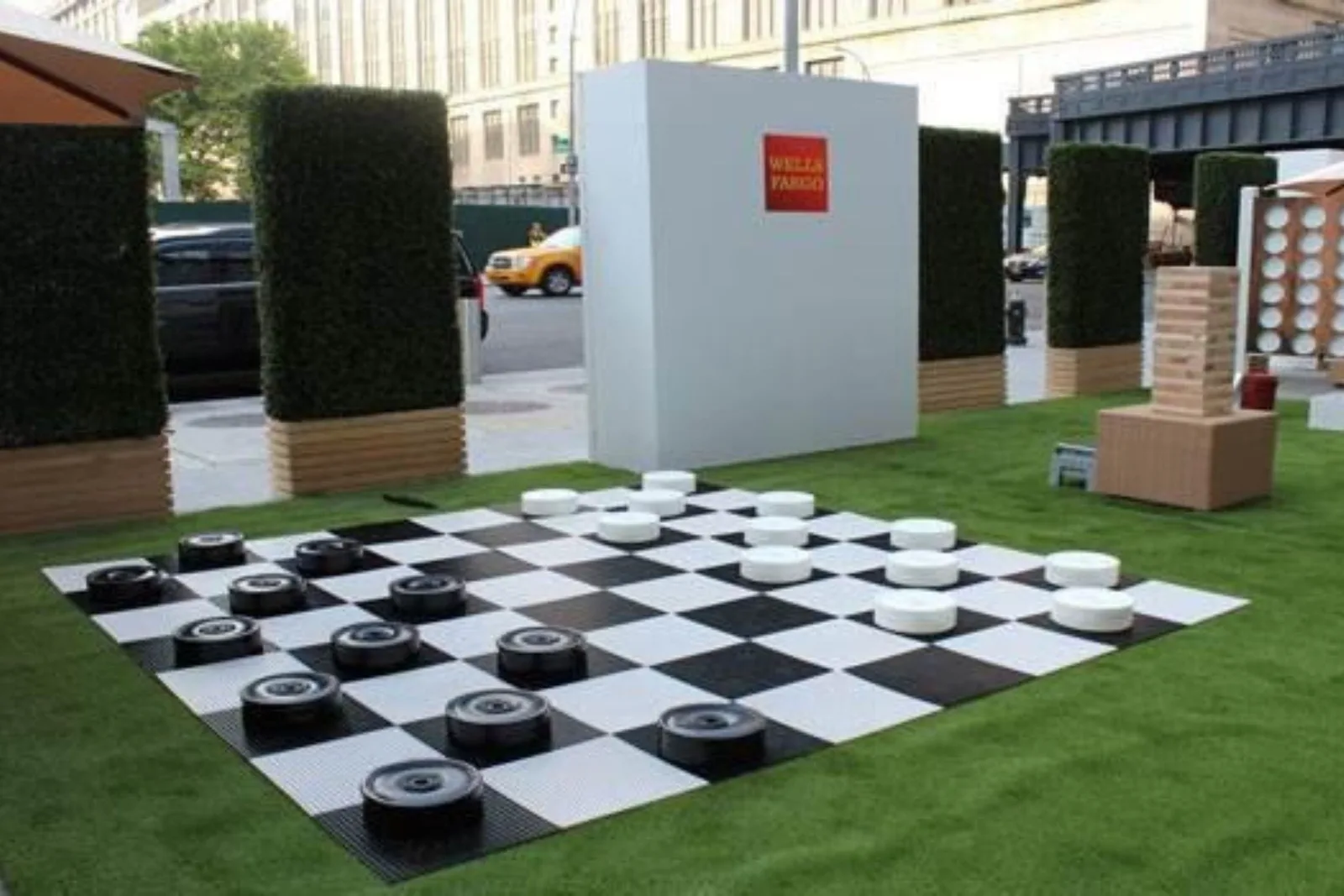 Artificial grass lawn for a Wells Fargo promotional event with giant checkboard and Jenga yard games