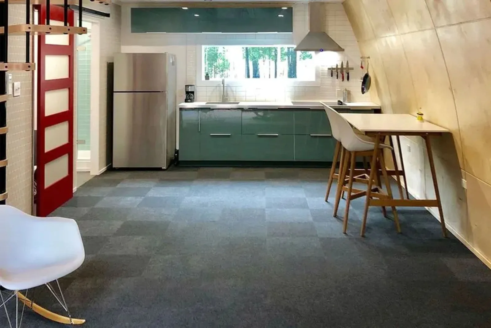 Modern kitchen with durable gray checkered carpet tiles, a versatile and practical residential flooring solution for high-traffic areas.