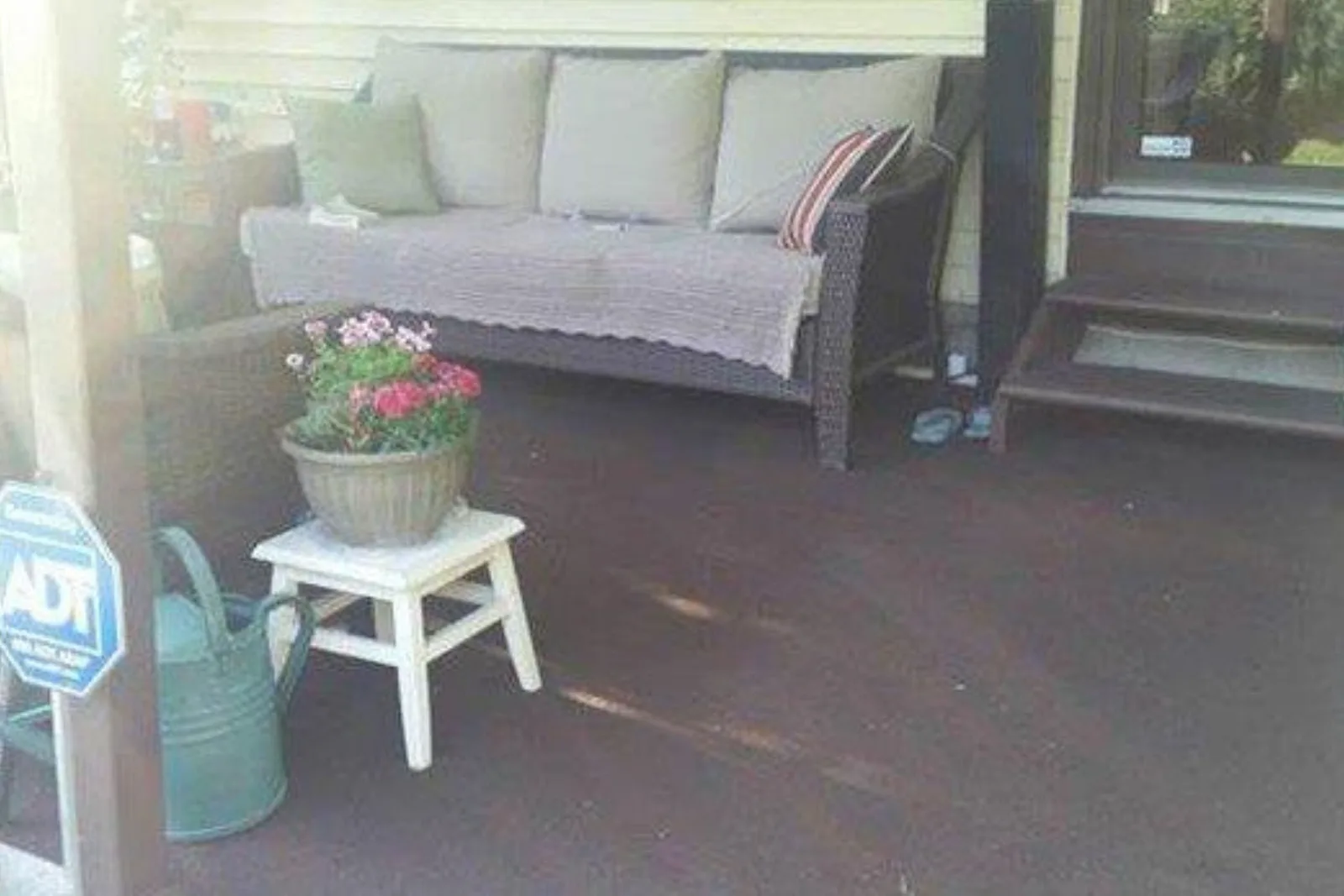 Outdoor patio with a durable dark brown outdoor rug, a perfect and stylish, weather-resistant flooring solution.