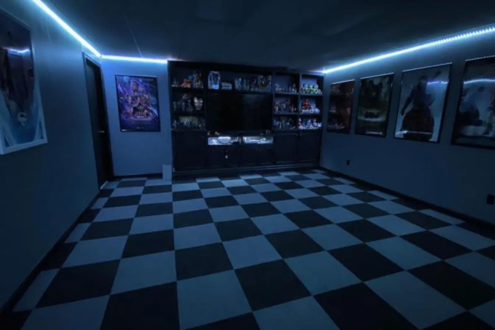 Durable checkered carpet tiles Stylish game room with durable black and gray checkered carpet tiles, a modern and functional flooring solution for a media or entertainment space.