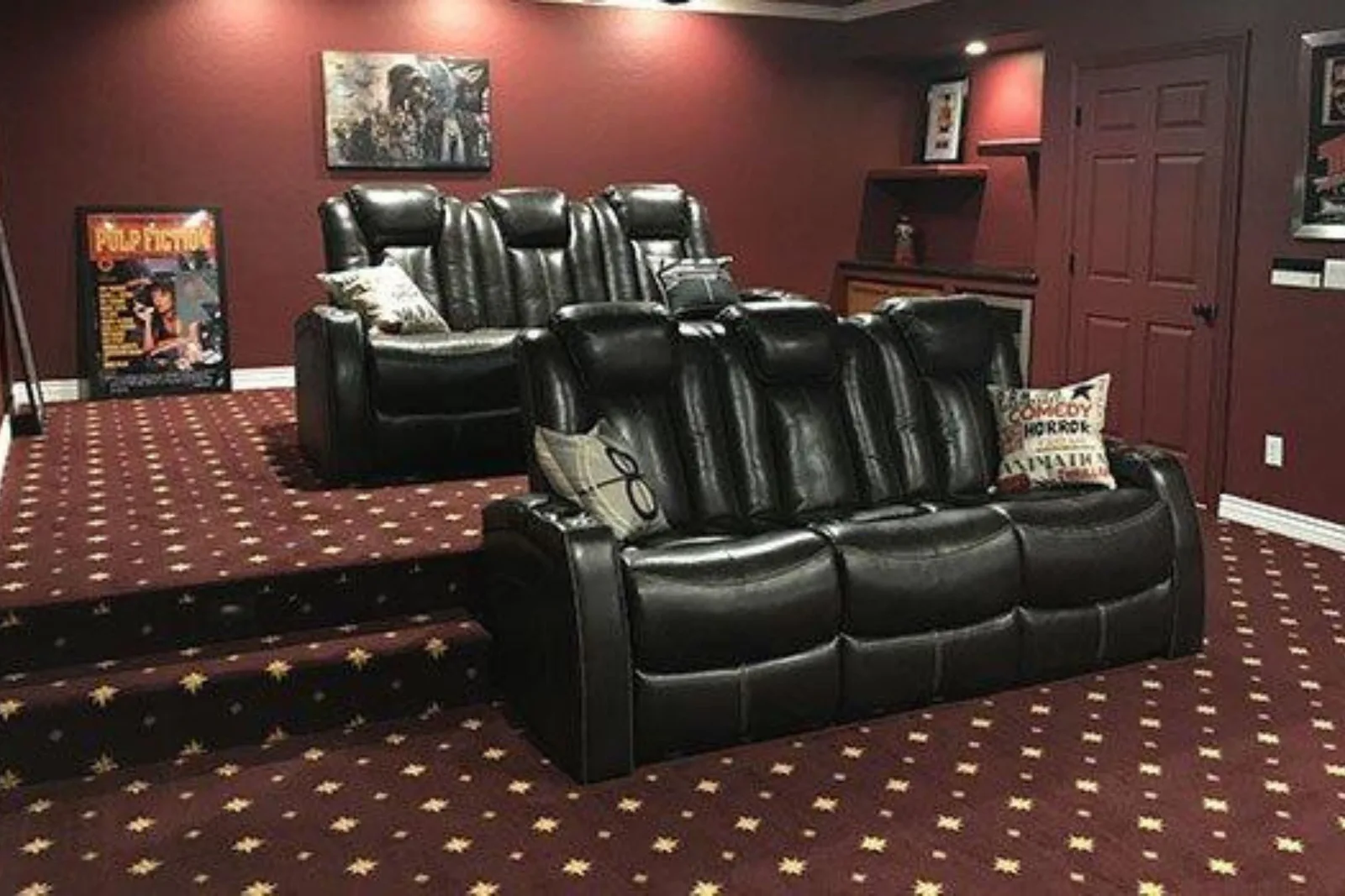 Luxury home theater with a dark red patterned carpet, a plush and stylish flooring solution perfect for creating a cozy atmosphere.
