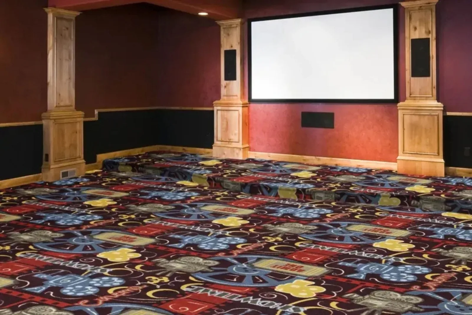 Fun home theater with a colorful patterned carpet featuring film reels, popcorn, and tickets, a unique and comfortable residential flooring option.