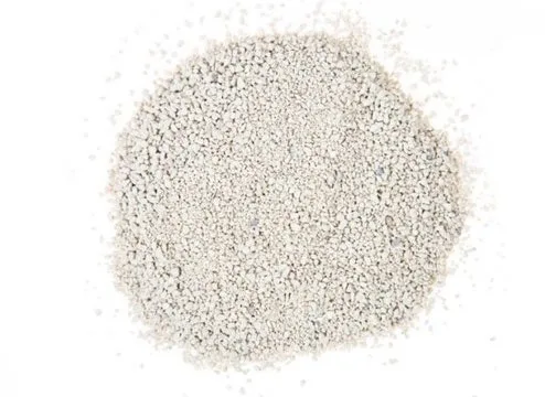 A pile of Zeolite Max turf infill, showcasing the white granular material that helps to deodorize and support artificial grass, especially for pet turf applications.