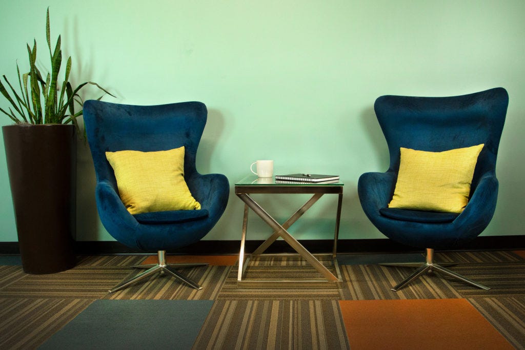 two chairs and table over low pile carpet