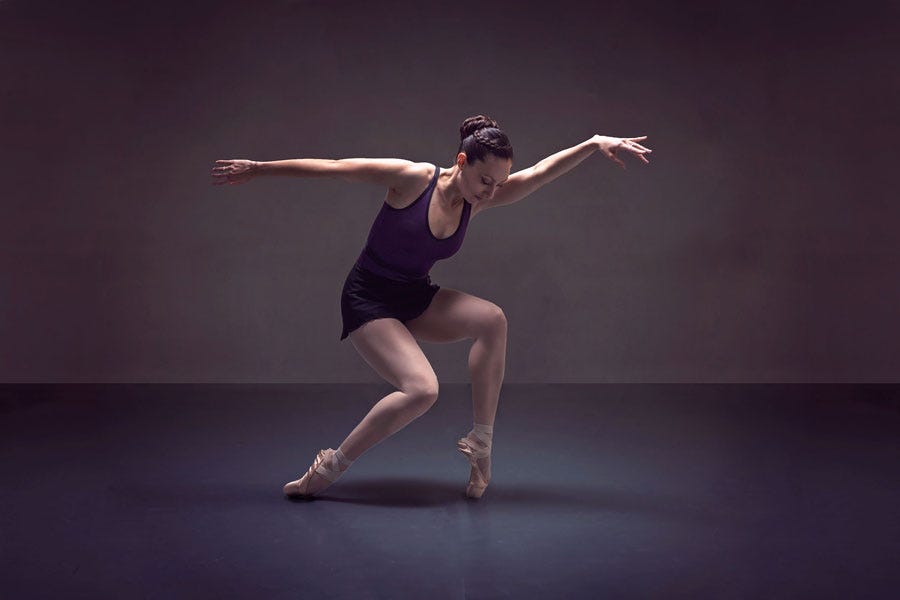 a dancer doing a pose on versastep dance flooring