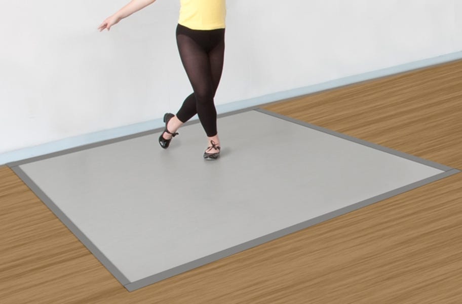 a dancer practicing on a small dance floor mat