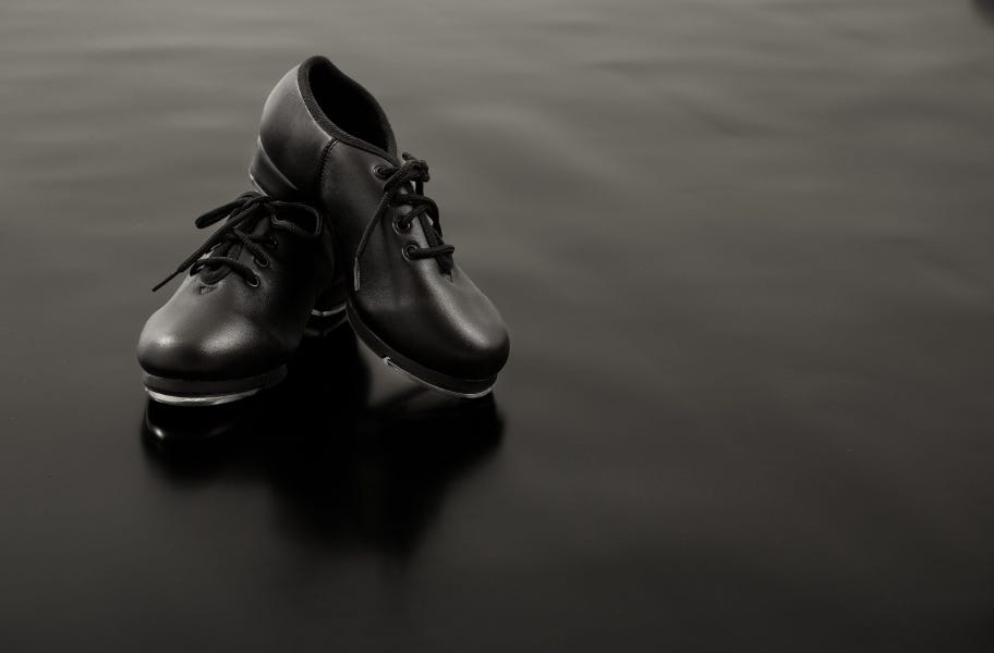 tap dance shoes on black Versa Step Dance Flooring