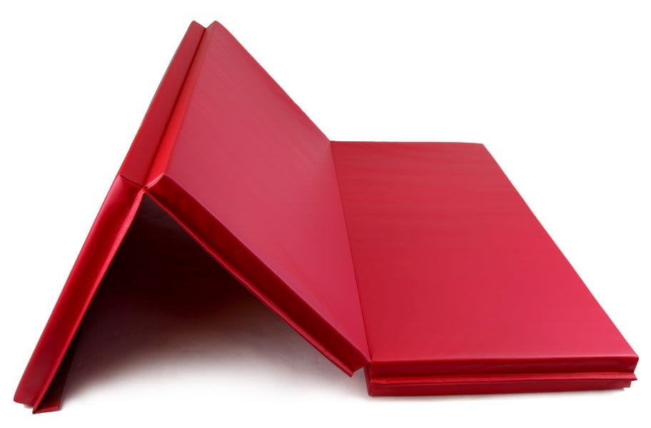 Red folding gymnastics mat