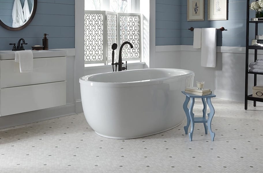 FlooringInc Vinyl Sheet Buying Guide: tile-look vinyl sheet in a bathroom setting.