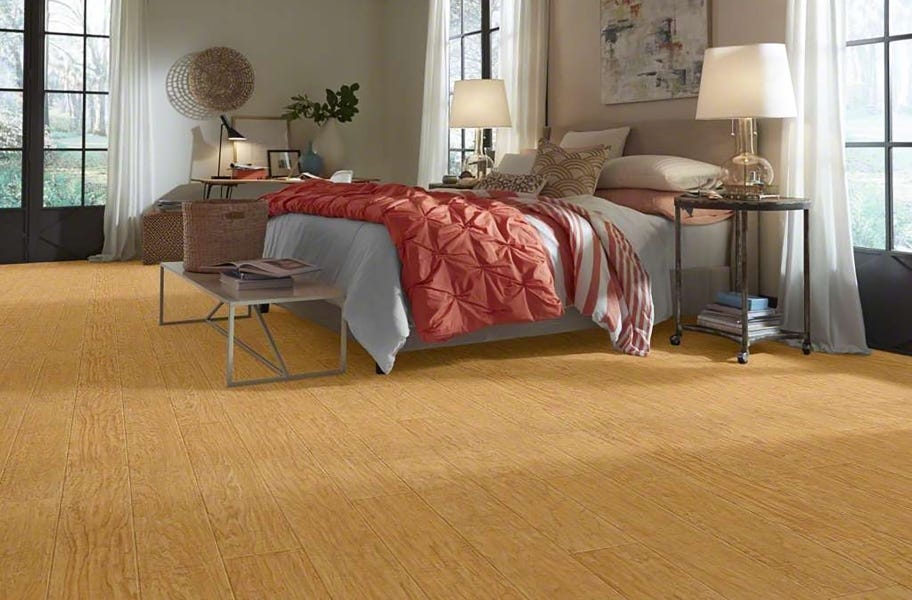 FlooringInc Vinyl Sheet Buying Guide: wood-look sheet vinyl in a bedroom