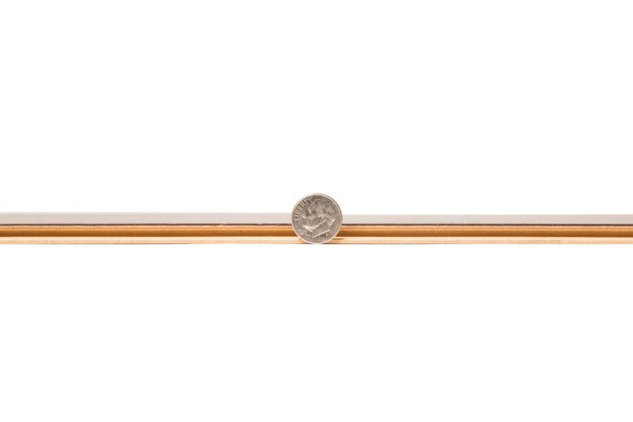 Laminate flooring thickness compared to a dime