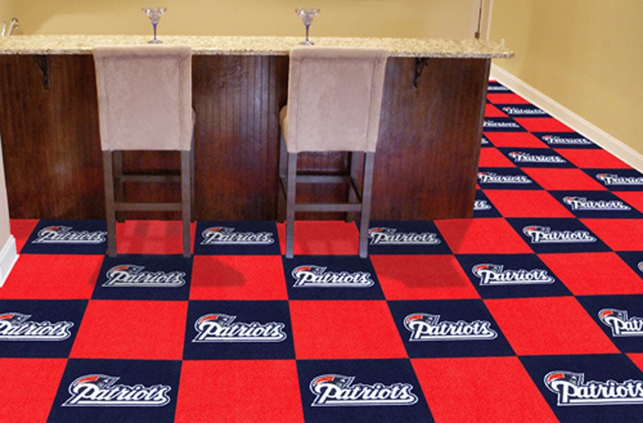 FlooringInc Fanmats NFL Carpet Tiles in a basement setting with a bar