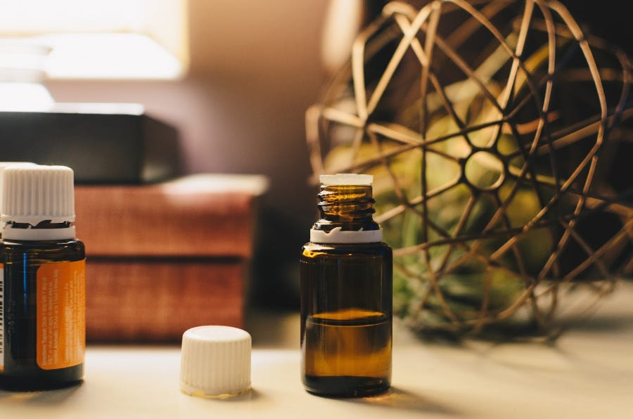 DIY Vinyl Floor Cleaners: oil in bottle on desk