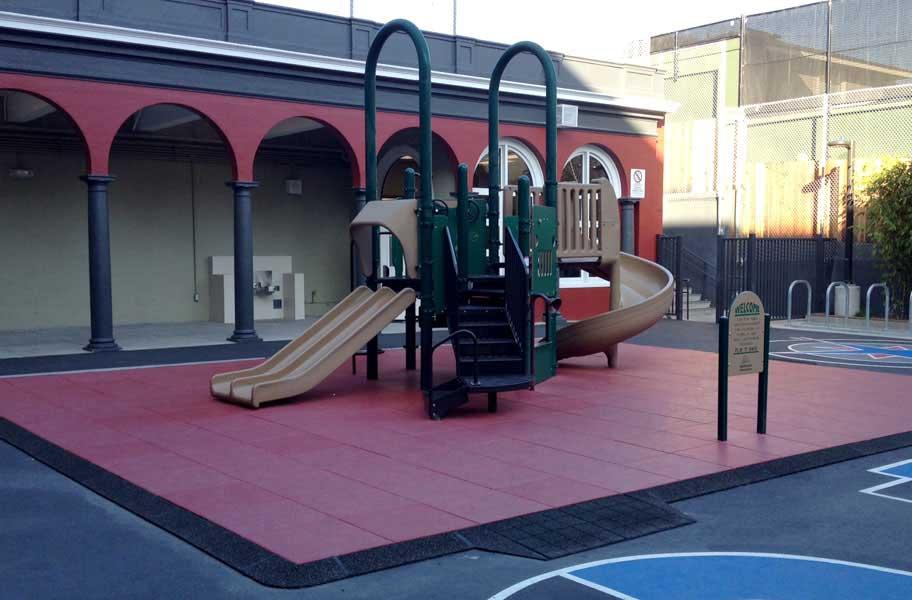 playground on top of red playground tiles