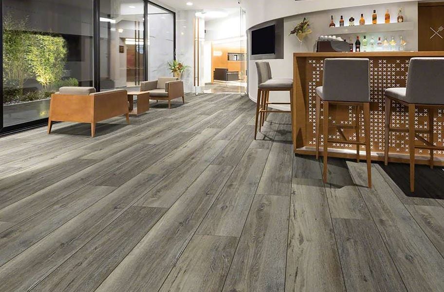 wiide plank wood-look flooring in a ktichen