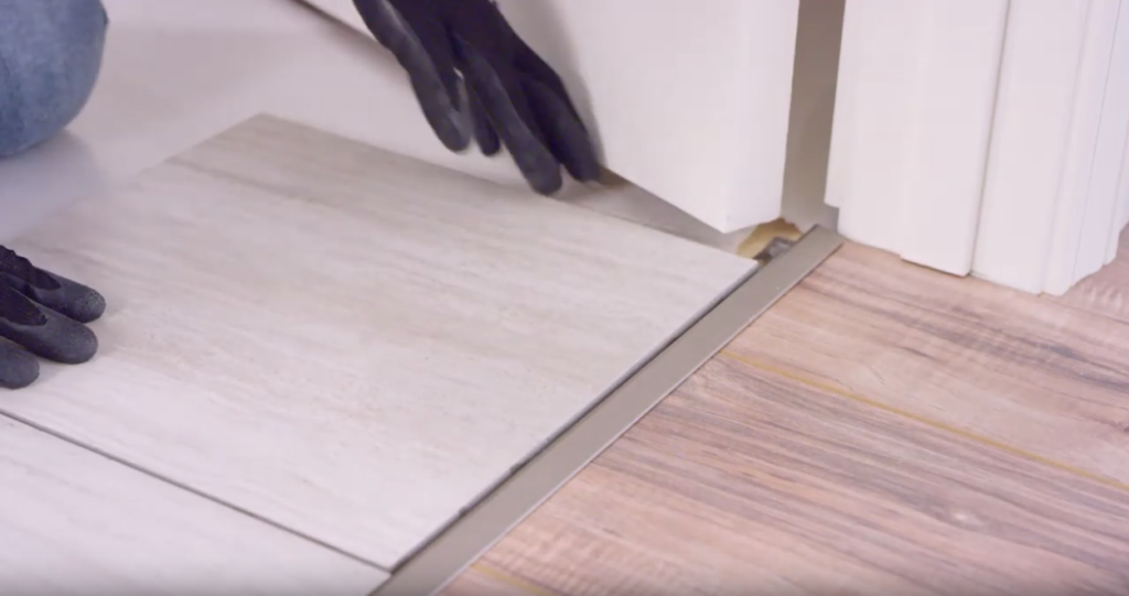 Stone look tile in a doorway transition