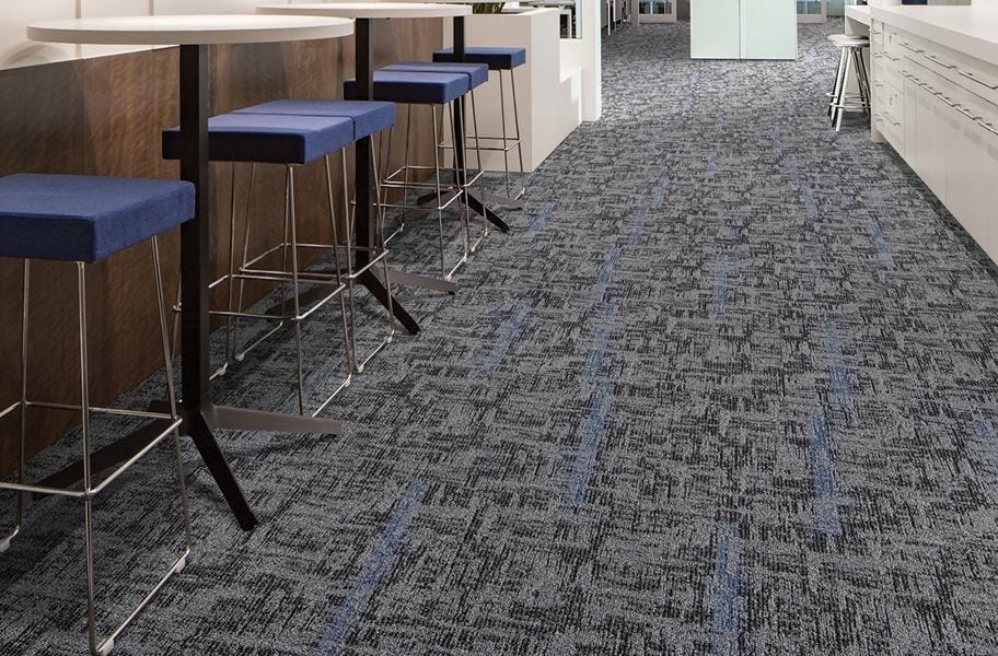 geometric patterned carpet tile in a commercial setting
