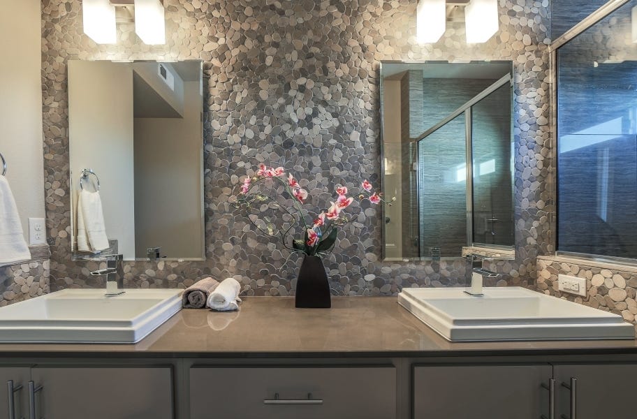 Accent Wall Ideas: stone pebble accent wall backsplash in a bathroom