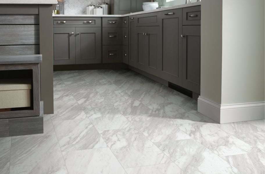Gray cabinetry paired with Shaw Paragon Tile Plus 12" Rigid Core Vinyl Planks