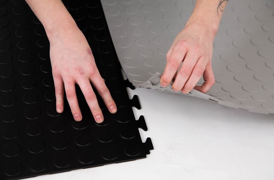 Food Truck Flooring: Black and Gray Coin Flex Nitro Tiles being installed