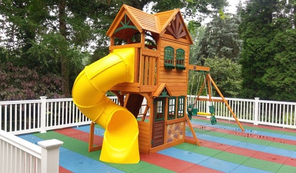 Colorful, residential playground created with our Safe-Play Tiles. 
