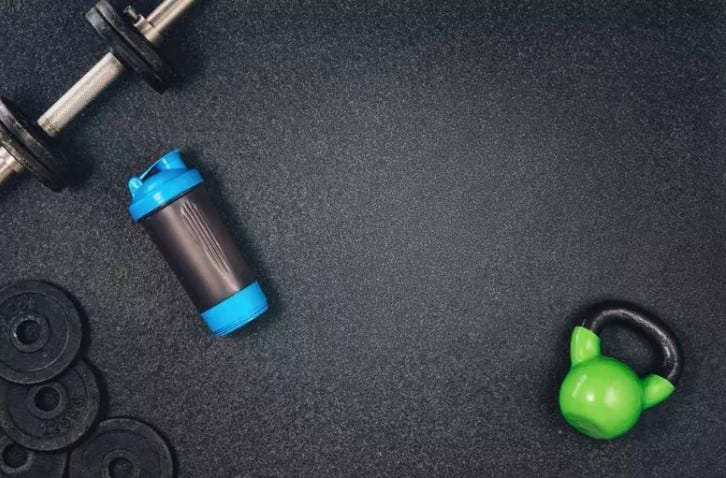 ExactFit Rubber Gym Tiles with weights on them