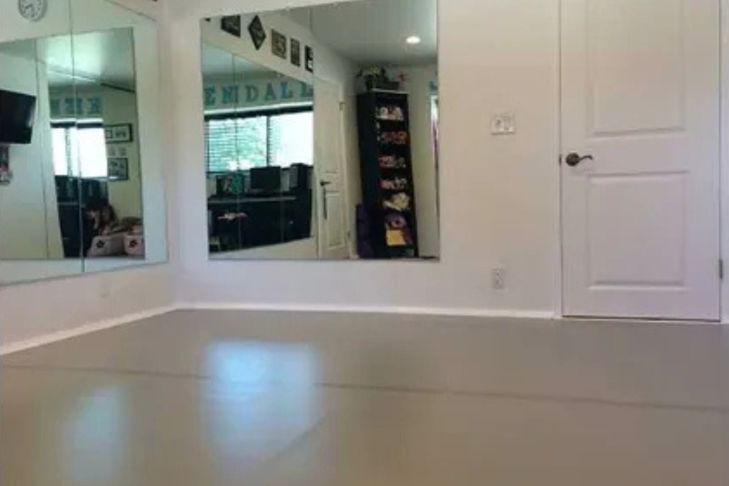 home dance studio with mirrors and gray marley dance floor