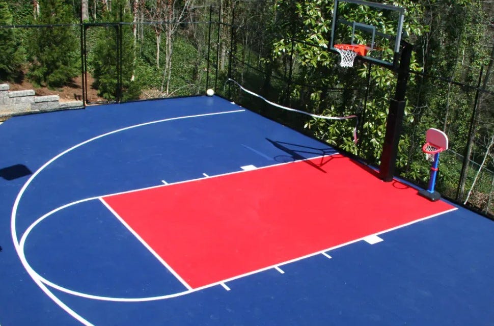 a red and blue home outdoor basketball court