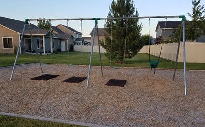 Playground Swing Mats used under a large home swing set